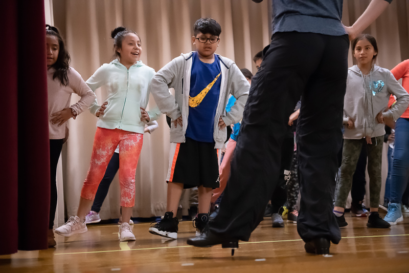 students doing exercises in tap dance class