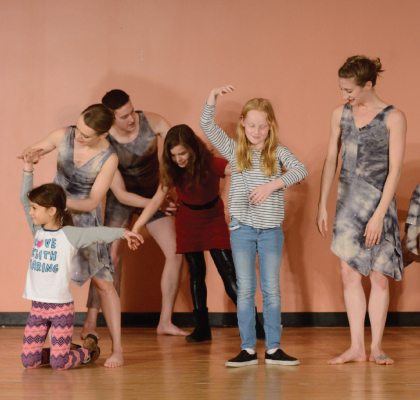 Amanda Selwyn Dance Theatre artists dancing in a community workshop at East Village Community School, NYC